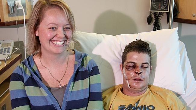 Jockey Luke Nolen with his wife Alicia in 2008 at Brisbane's St Andrew's Hospital with his horrific facial injuries. Picture: Annette Dew