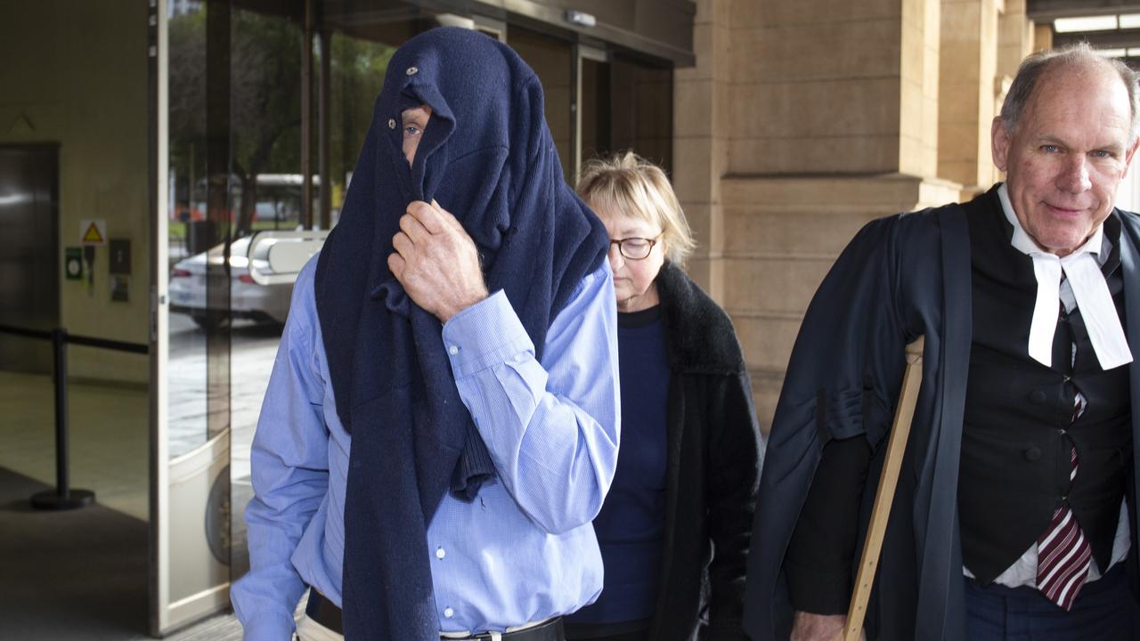 Shane Anthony Matherson, left, leaves the District Court in Adelaide in June after being found guilty. Picture: Brett Hartwig