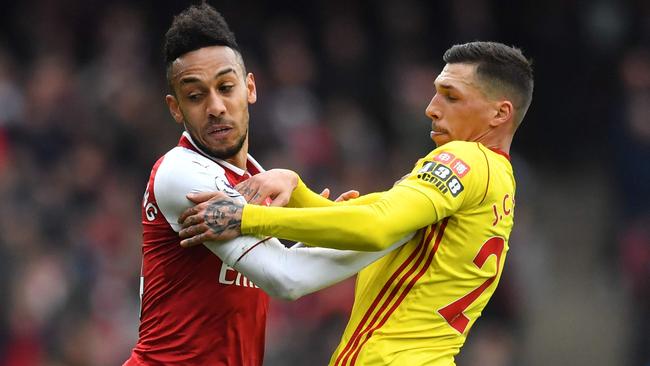 Arsenal's Gabonese striker Pierre-Emerick Aubameyang (L) vies with Watford's German-born Greek midfielder José Holebas