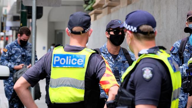 Australian Defence Force (ADF) personnel are seen arriving at the Pullman Hotel, where residents of the Holiday Inn medi-hotel were moved to, on February 11, 2021 in Melbourne, Australia. (Photo by Luis Ascui/Getty Images)