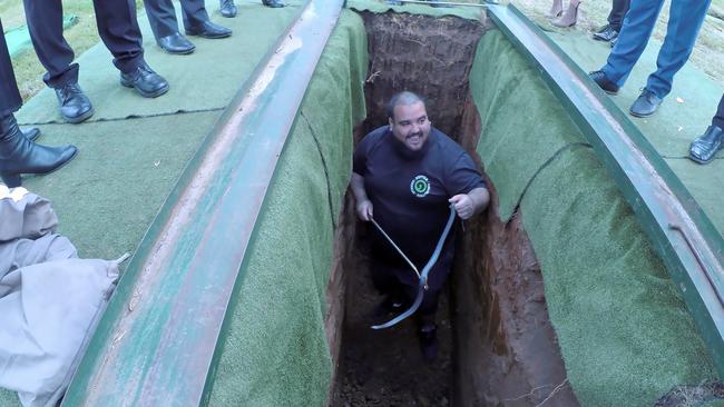 Mr Kerewaro pulled the snake out of the grave. Picture: Reptile Relocation Sydney