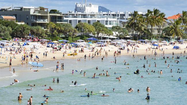 School holiday crowds pack into Noosa Main Beach. Picture: Lachie Millard.