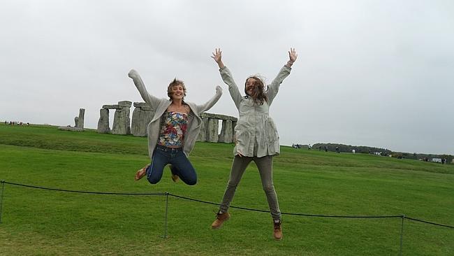 Jumping around to keep warm at Stonehenge with a new friend. Picture: Tatyana Leonov