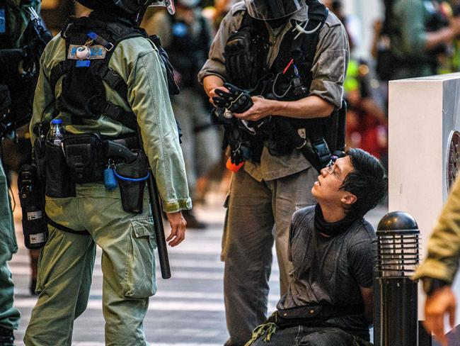 A protester is detained by police during a rally against a new national security law in Hong Kong. Picture: AFP