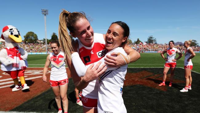 Alice Mitchell (L) and Aliesha Newman (R) celebrate victory after the Sydney Swans beat the Collingwood Magpies at Henson Park on October 29. Photo: Matt King/Getty Images