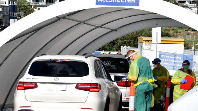 A drive-through COVID-19 testing center in Sydney. (Photo by Saeed KHAN / AFP)