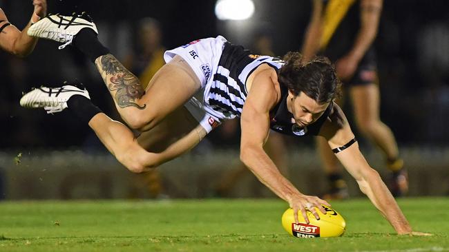 Port Adelaide's Jasper Pittard falls to the ground against Glenelg. Picture: Tom Huntley