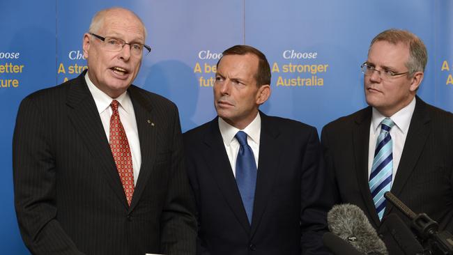 Then opposition leader Tony Abbott, centre, and then immigration spokesman Scott Morrison, right, listen to Jim Molan during the launch of the Coalition's asylum-seekers policy in 2013. Picture: AAP