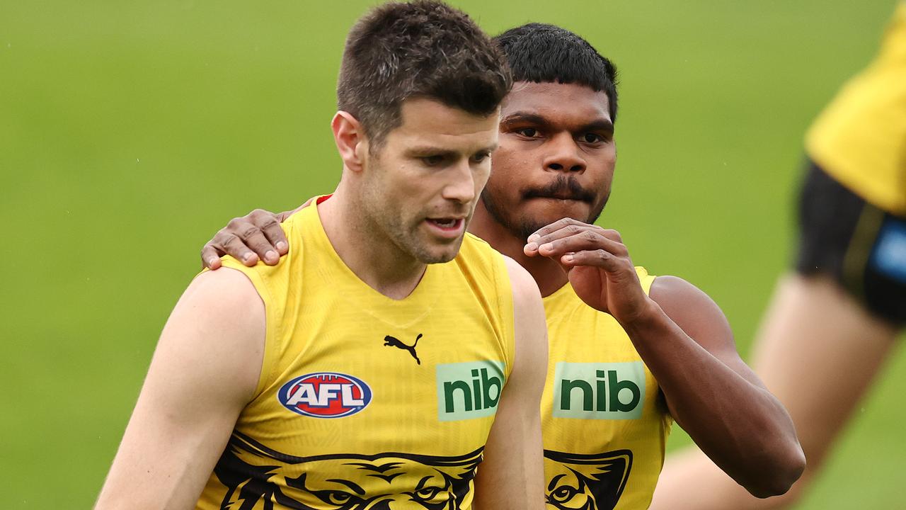 Trent Cotchin gets some encouragement from Maurice Rioli Jr. Picture: Michael Klein