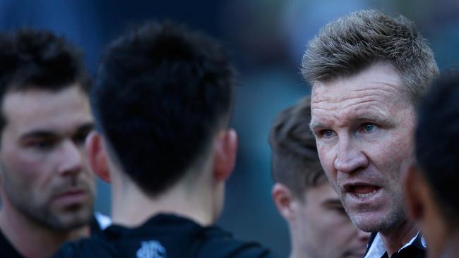 MELBOURNE, VICTORIA - JULY 15: Nathan Buckley, Senior Coach of the Magpies speaks to his players during the round 17 AFL match between the Collingwood Magpies and the West Coast Eagles at Melbourne Cricket Ground on July 15, 2018 in Melbourne, Australia. (Photo by Darrian Traynor/AFL Media/Getty Images)