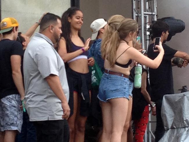 Malia Obama wears a crop top to rock out at Lollapalooza. Picture: Splash