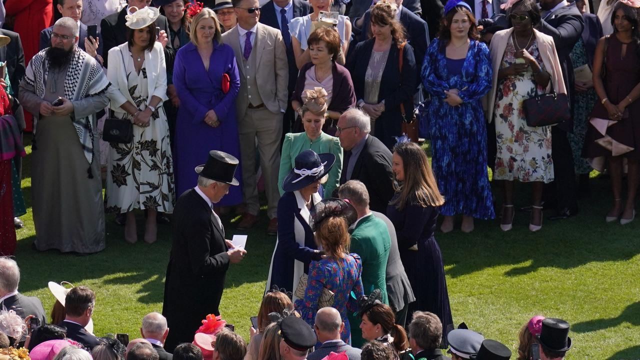 The Queen Consort shook hands with guests as she made her way across the manicured lawns. Picture: Jonathan Brady/Pool/AFP