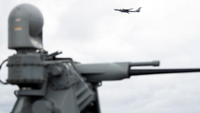 A Russian Tupolev TU-142 flies by the USS Mount Whitney of the US Navy during the NATO-led military exercise Trident Juncture. Moscow may have attempted to jam GPS systems during the war games. Picture: AFP