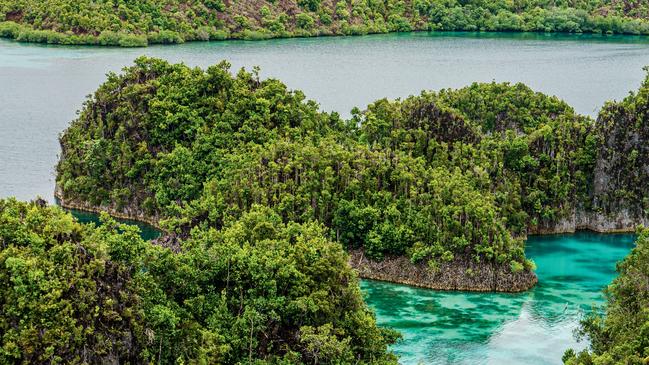 Raja Ampat’s islets seen from Penem Island. Photography: Chris Schalkx.