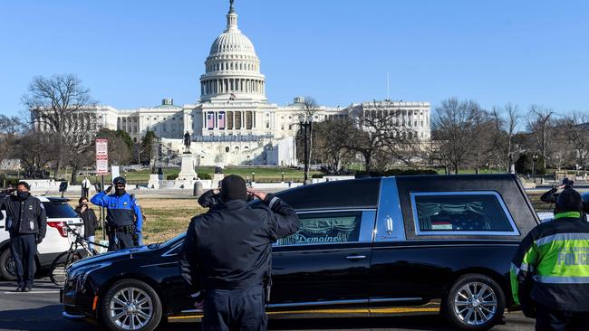 Capitol police stand at attention as the casket with fallen police officer Brian Sicknick passes during a funeral procession in Washington on Monday. Picture: AFP