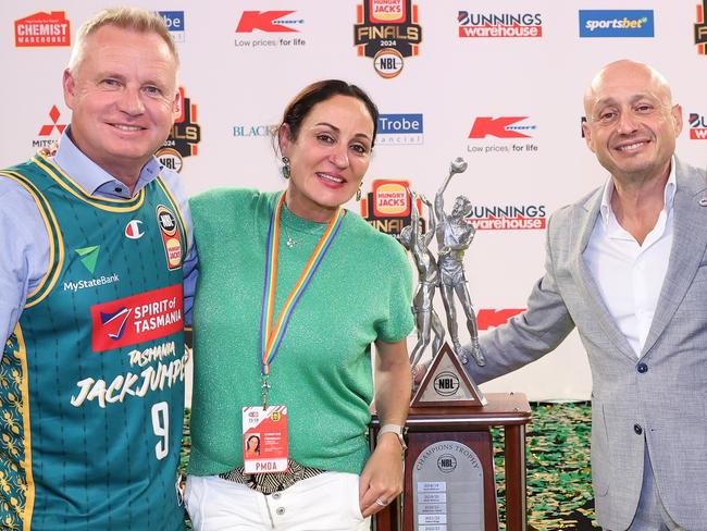 Tasmania Premier Jeremy Rockliff, Tasmania JackJumpers chief executive Christine Finnegan, NBL and JackJumpers owner Larry Kestelman with the NBL championship trophy. Picture: Getty Images