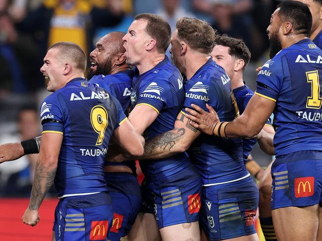 SYDNEY, AUSTRALIA - MAY 30: Junior Paulo of the Eels celebrates with team mates after scoring a try during the round 13 NRL match between Parramatta Eels and Cronulla Sharks at CommBank Stadium on May 30, 2024, in Sydney, Australia. (Photo by Cameron Spencer/Getty Images)