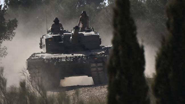 Ukrainian military personnel receive armoured manoeuvre training on German-made Leopard 2 battle tanks at the Spanish army's training centre in Zaragoza last March. Picture: AFP