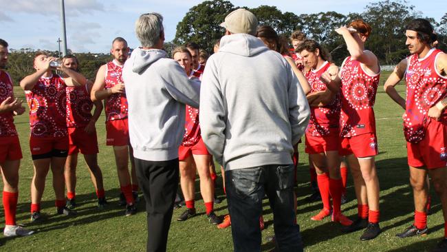 COACH: Lismore Swans senior men's coach Ashley Pritchard and assistant Glenn Burns remind players of the strategy ahead of the Sir Doug Nicholls Round against Sawtell Toormina Devils on May 29, 2021. Photo: Alison Paterson