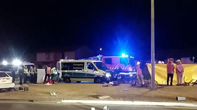 Emergency service personnel at the scene where Ethel Boyce was killed at Elizabeth South. Picture: David Young