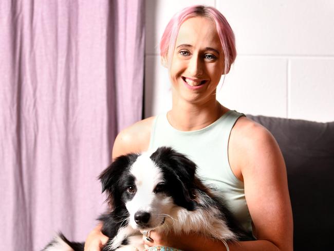 Madison Brown23,  hashas completed a year of treatment for a rare form of ovarian cancer. Pictured with her 9m Border Collie Harley. Picture: Alix Sweeney