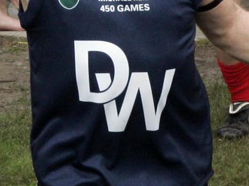 s09os961 FOOTBALL SFL .. Dandenong v Sandown ( Sat.21/08/10 )  Dandy West 5 Mick Reid leads his team out for his 450th game