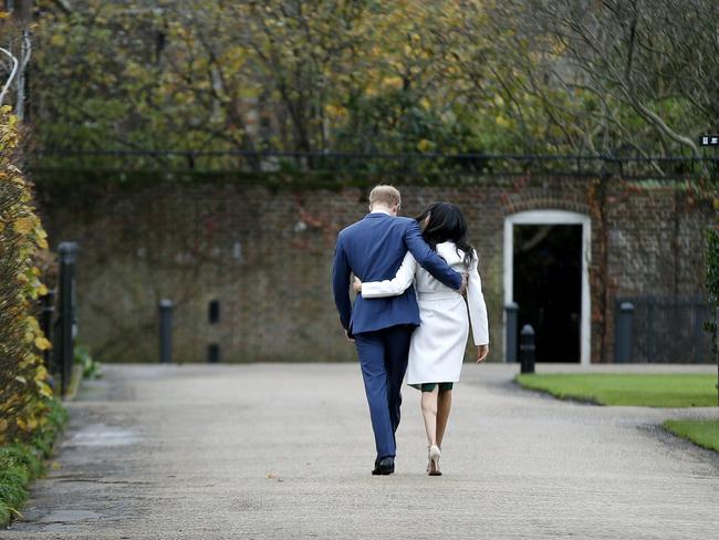 Britain’s Prince Harry and Meghan Markle walk away after posing for the media. Picture: AFP/Daniel Leal-Olivas