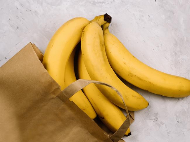 top view fresh bananas in paper bag