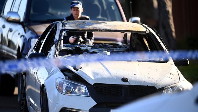 A burnt-out car was discovered after a man was shot dead in Canterbury overnight. Picture: Jeremy Piper