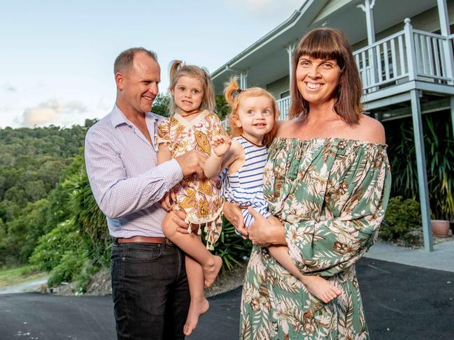 Corinne and Mark Russell with kids Lola, 3, and Penny, 2, are about to auction their Tallebudgera Valley home. The last three months of 2018 saw auction clearance rates plumb lows of just over 40 per cent, down from 62 per cent a year ago. Picture by Luke Marsden.