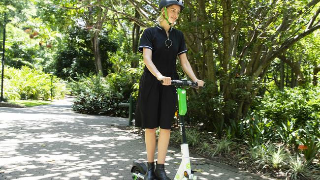 Anna Moreton rides a Lime Scooter. Photo Lachie Millard