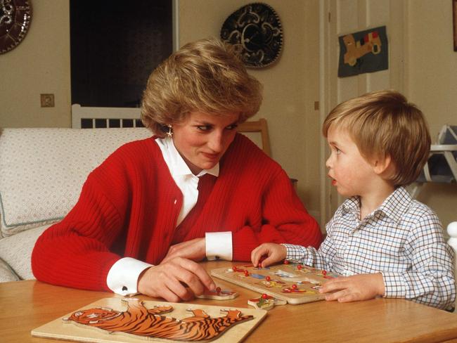 Princess Diana helping Prince William with a jigsaw puzzle. Picture: Tim Graham