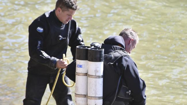 Police search a reservoir in country Victoria for the gun used to kill Melbourne underworld figure Graham "The Munster" Kinniburgh. Picture: Ian Wilson