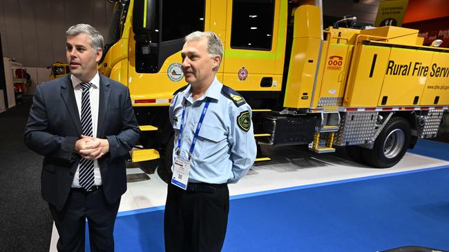 Fire and Emergency Services Minister Mark Ryan and Rural Fire Brigades Association Queensland general manager Justin Choveaux with a new fire truck in August. Picture: Lyndon Mechielsen/Courier Mail