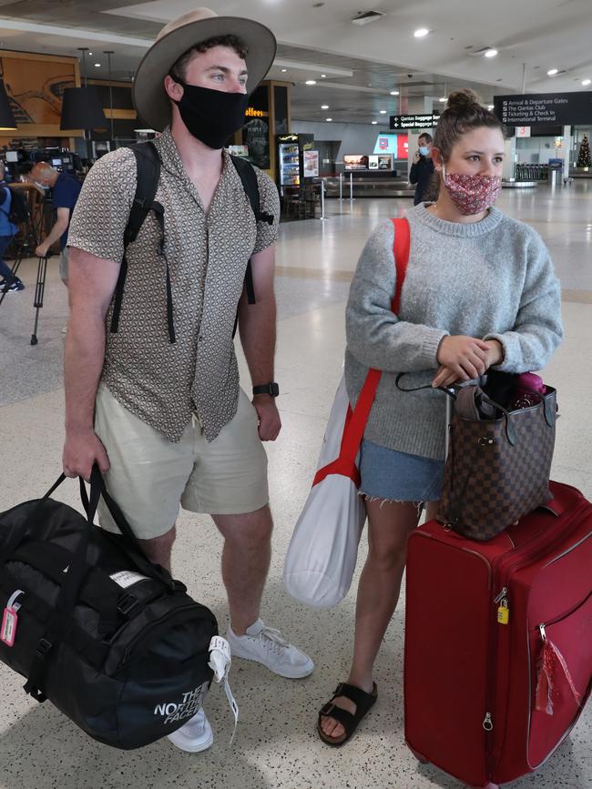 Jessica Hickey and Spencer Davis land at Melbourne Airport from Brisbane. Picture: David Crosling