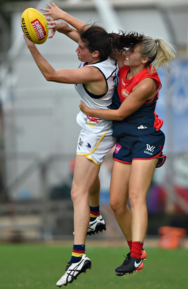 Adelaide’s Jess Sedunary takes a mark opposed to Melbournes’ Elise Strachan.