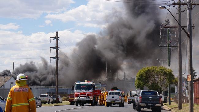 Smoke hangs over the scene of a grassfire in William St, Orange yesterday. A boy has been charged over sparking the fire. Picture: Gavin Coote ‏@GavinCoote