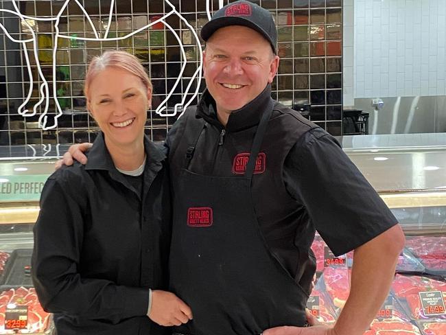 Owners of Stirling Variety Meats Chris and Giselle Pfitzner outside their store in Stirling Village shopping centre before it was completely destroyed yesterday. Photo: Instagram