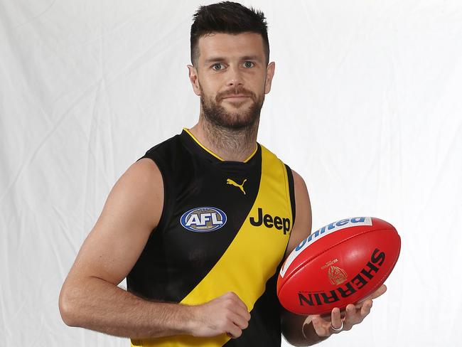 Some parents are questioning why they have to pay for expensive socks made by Richmond skipper Trent Cotchin’s business. Picture: Michael Klein