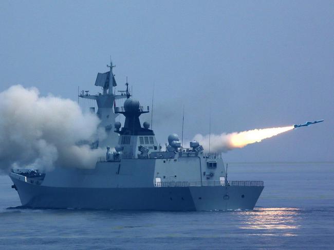 A Chinese destroyer fires a missile during recent military exercises off Tawian. Picture: Xinhua