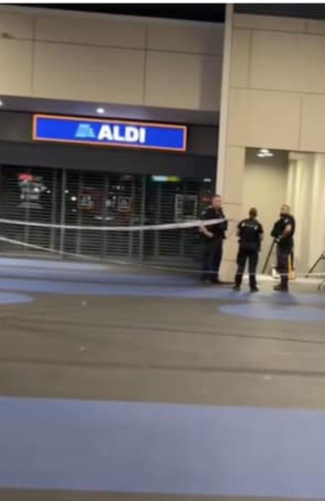 Police in front of Redbank Plains Aldi after the stabbing of Vyleen White on Saturday.