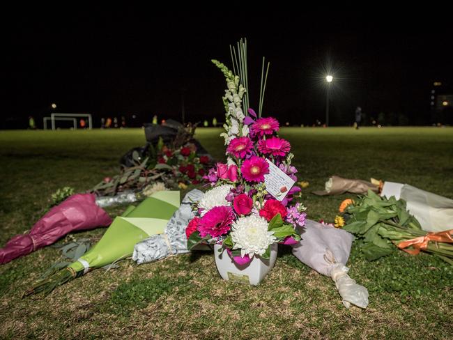 Flowers left for Eurydice Dixon in Carlton North. Picture: Jake Nowakowski