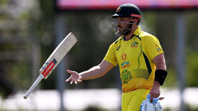 Australia's captain Aaron Finch walks off after being dismissed during the third one-day international (ODI) cricket match between Australia and Zimbabwe at the Riverway Stadium in Townsville on September 3, 2022. (Photo by William WEST / AFP) / – IMAGE RESTRICTED TO EDITORIAL USE – STRICTLY NO COMMERCIAL USE –
