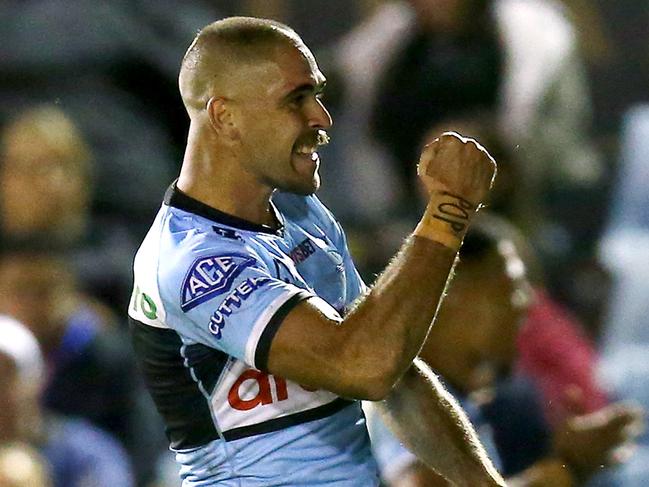 SYDNEY, AUSTRALIA - APRIL 01: William Kennedy of the Sharks scores a try during the round four NRL match between the Cronulla Sharks and the Newcastle Knights at PointsBet Stadium on April 01, 2022, in Sydney, Australia. (Photo by Jason McCawley/Getty Images)