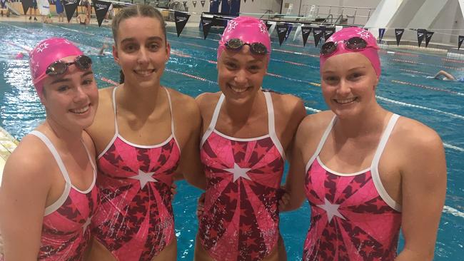 Moreton Bay College teammate celebrate the win of Lily Price, third across, at the QGSSSA meet.