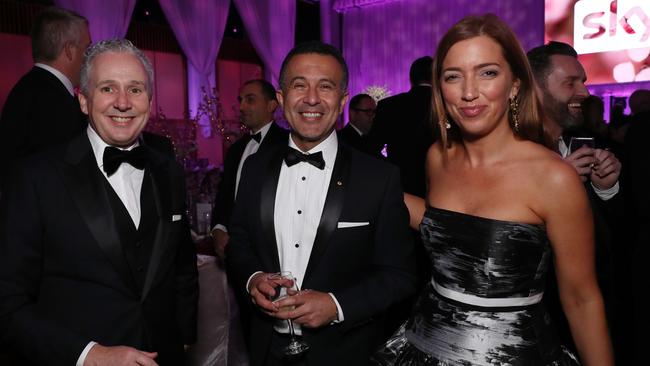 Telstra boss Andy Penn, SBS boss Michael Ebeid and Kallie Blauhorn arrive for the Midwinter Ball at Parliament House in Canberra. Picture: Gary Ramage