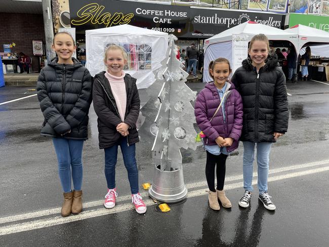 Stanthorpe Netball friends Ava Hobba (11), Isabella Jackson (9), Stella Hobba (8) and Ashley Jackson (11) just came from volunteering at the sausage sizzle at Snowflakes in Stanthorpe 2021. Photo: Madison Mifsud-Ure / Stanthorpe Border Post