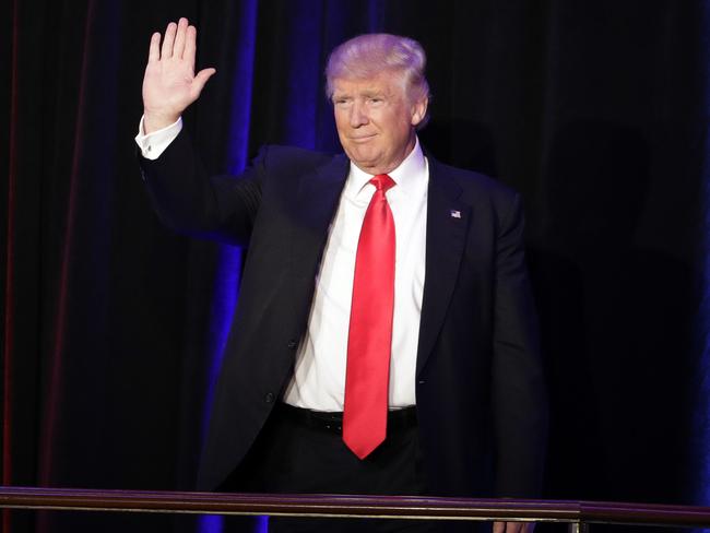 President-elect Donald Trump waves as he arrives at his election night rally. Picture: AP Photo/John Locher