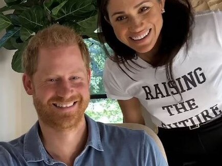 During the documentary, Meghan Markle is seen looking over Prince Harry's shoulder. Picture: Supplied