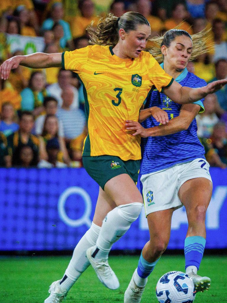 Australia's Winonah Heatley (L) and Brazil's Bruna Santos Nhaia fight for the ball during the women's international football friendly match between Australia and Brazil at Suncorp Stadium in Brisbane on November 28, 2024. (Photo by Patrick Hamilton)